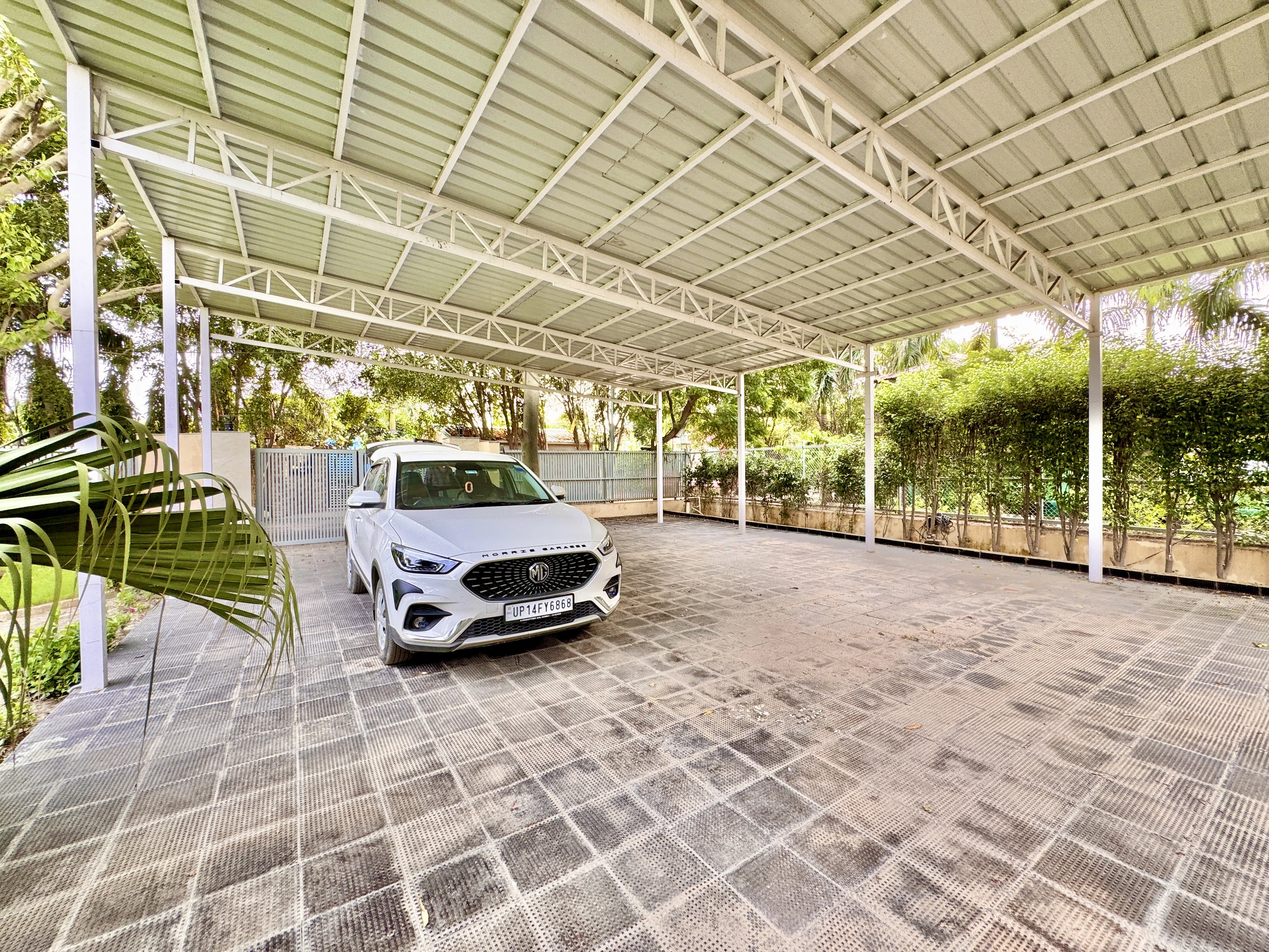 The covered car park at Mulberry Farm looking towards the lawn