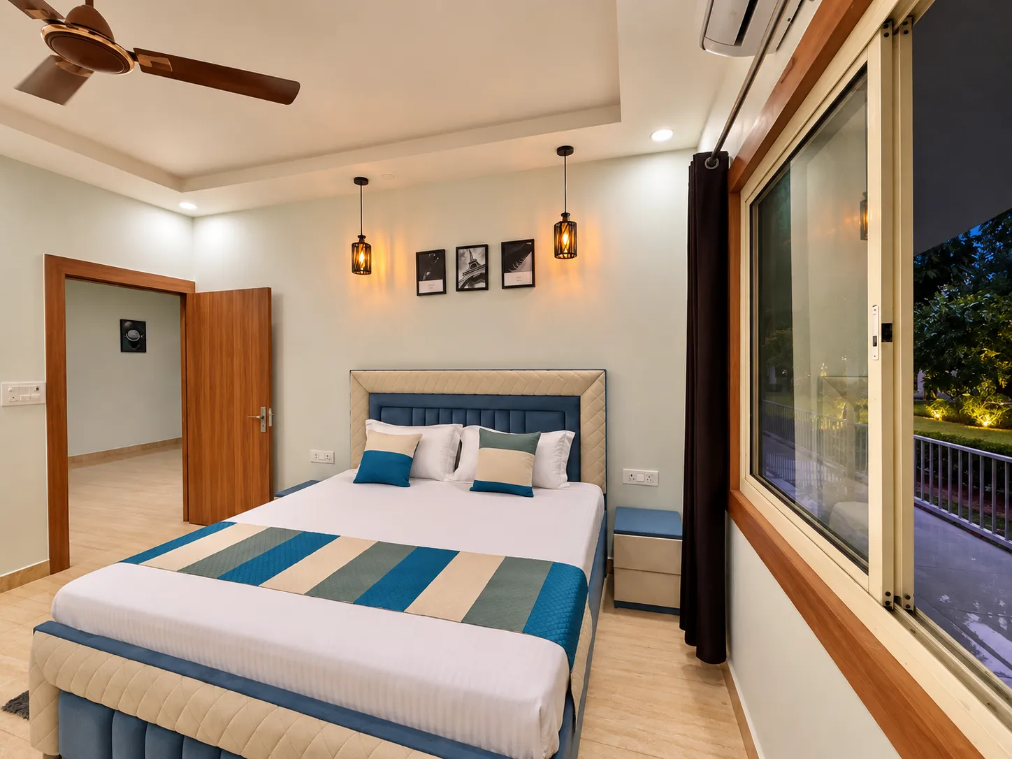 Bedroom one at Mulberry Farm — double bed, air conditioning and a window onto the garden, Sector 135 Noida