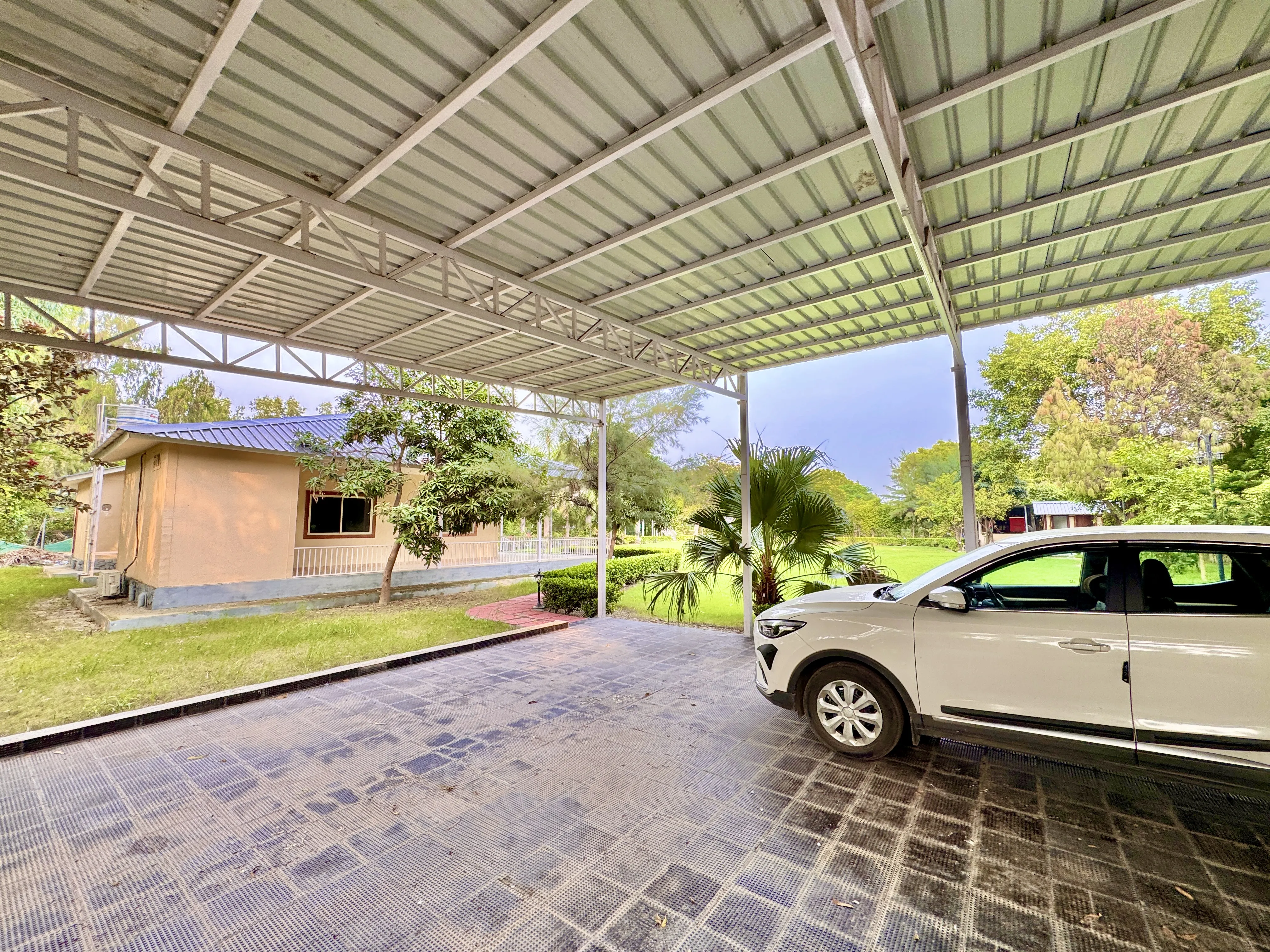 Covered parking just inside the gate at Mulberry Farm, Sector 135 Noida