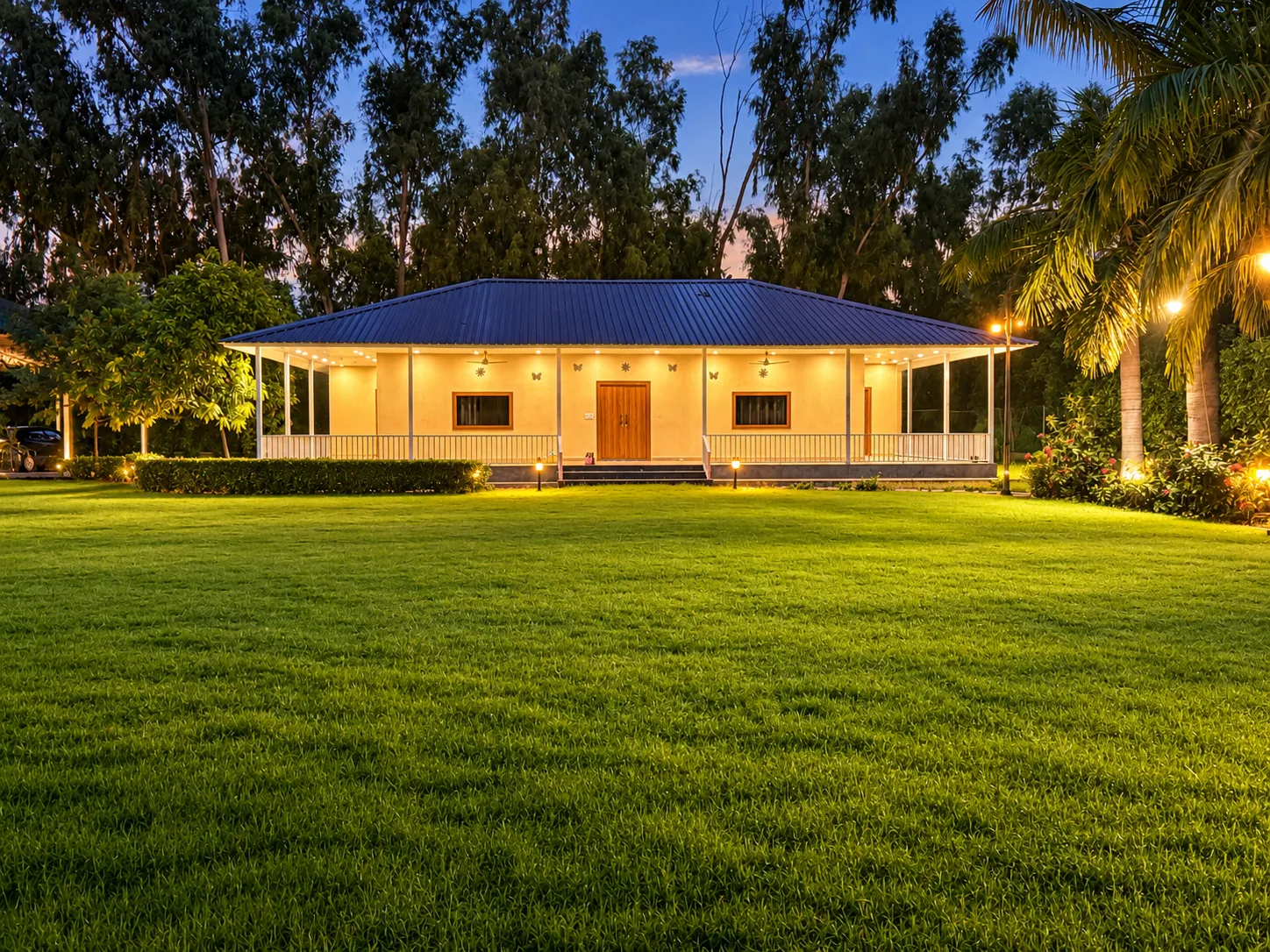 The lawn and farmhouse at Mulberry Farm after dark